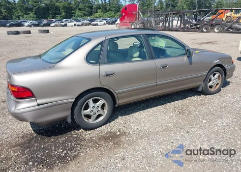 1999 Toyota Avalon Xls z USA, uszkodzony, nr VIN 4T1BF18B2XU322737